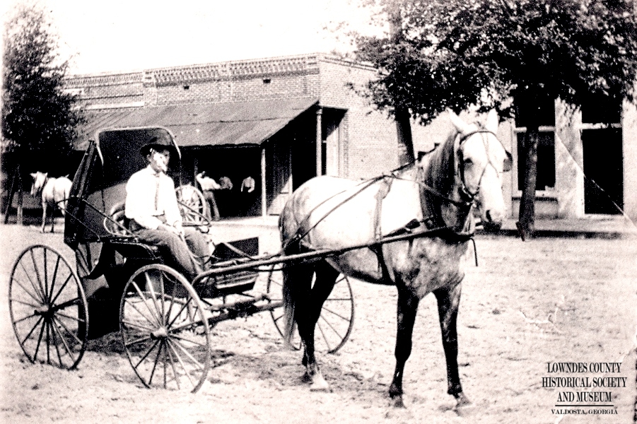A horse and buggy in downtown Valdosta, before paved roads