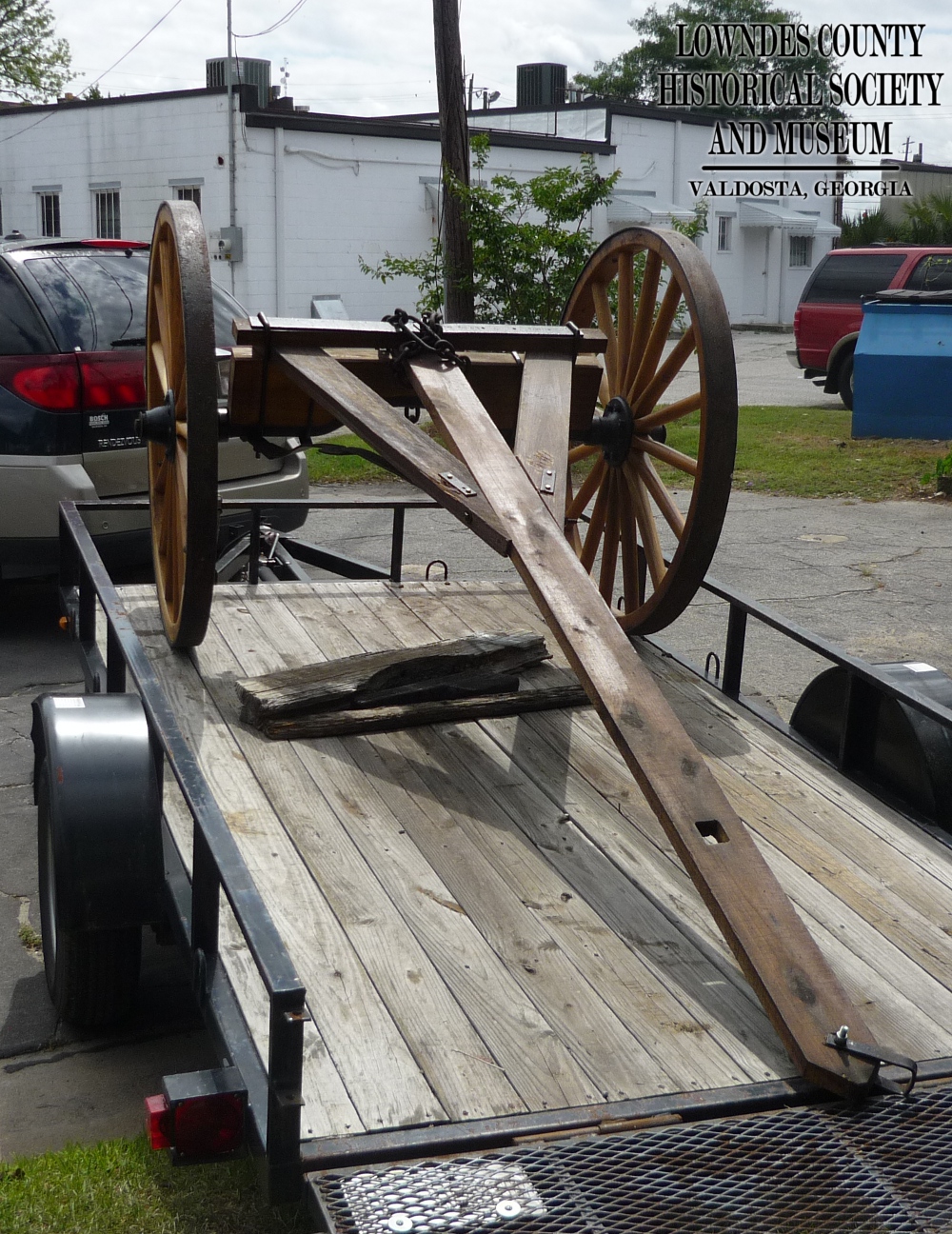 The restored log cart returning to the museum