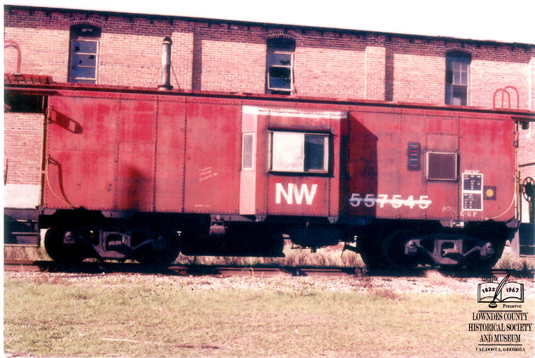 The caboose at its former home near the overpass